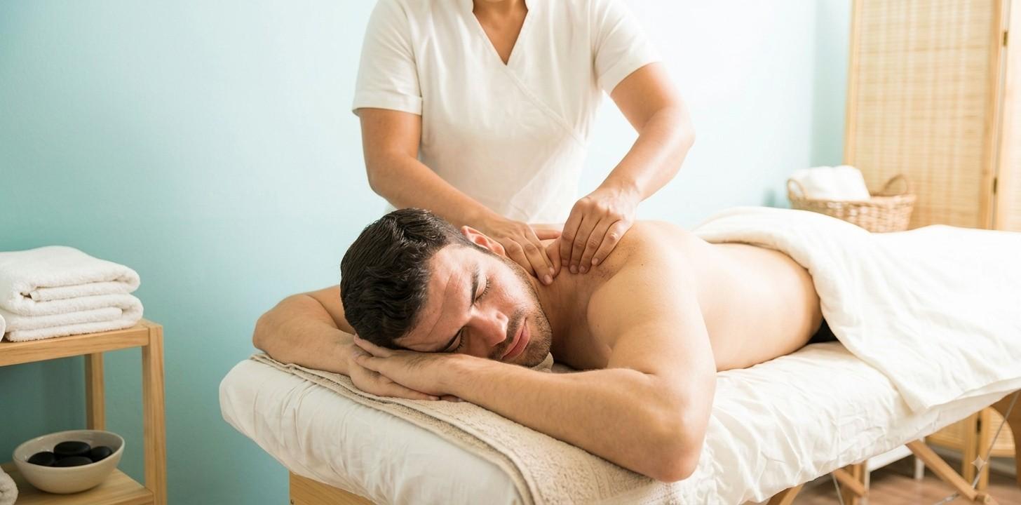 A professional therapist performing a full-body massage therapy session on a relaxed client in a calm spa environment.